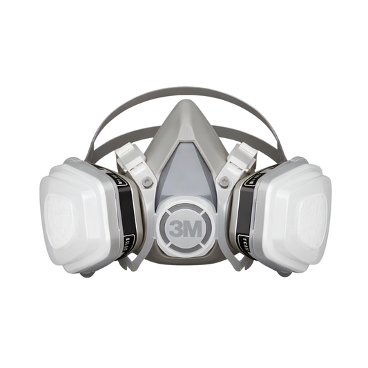A 3M half-face respirator mask with two white filter canisters attached on either side, shown against a plain white background.