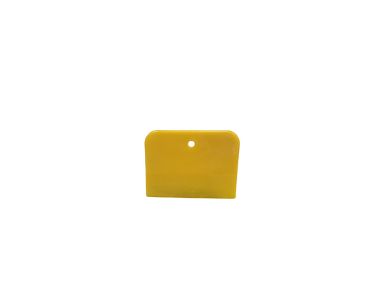 Single yellow 3x4 inch plastic spreader with a hang hole, used for applying body filler or putty, shown against a white background.