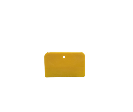 Single yellow 3x5 inch plastic spreader with a hang hole, used for applying body filler or putty, shown against a white background.